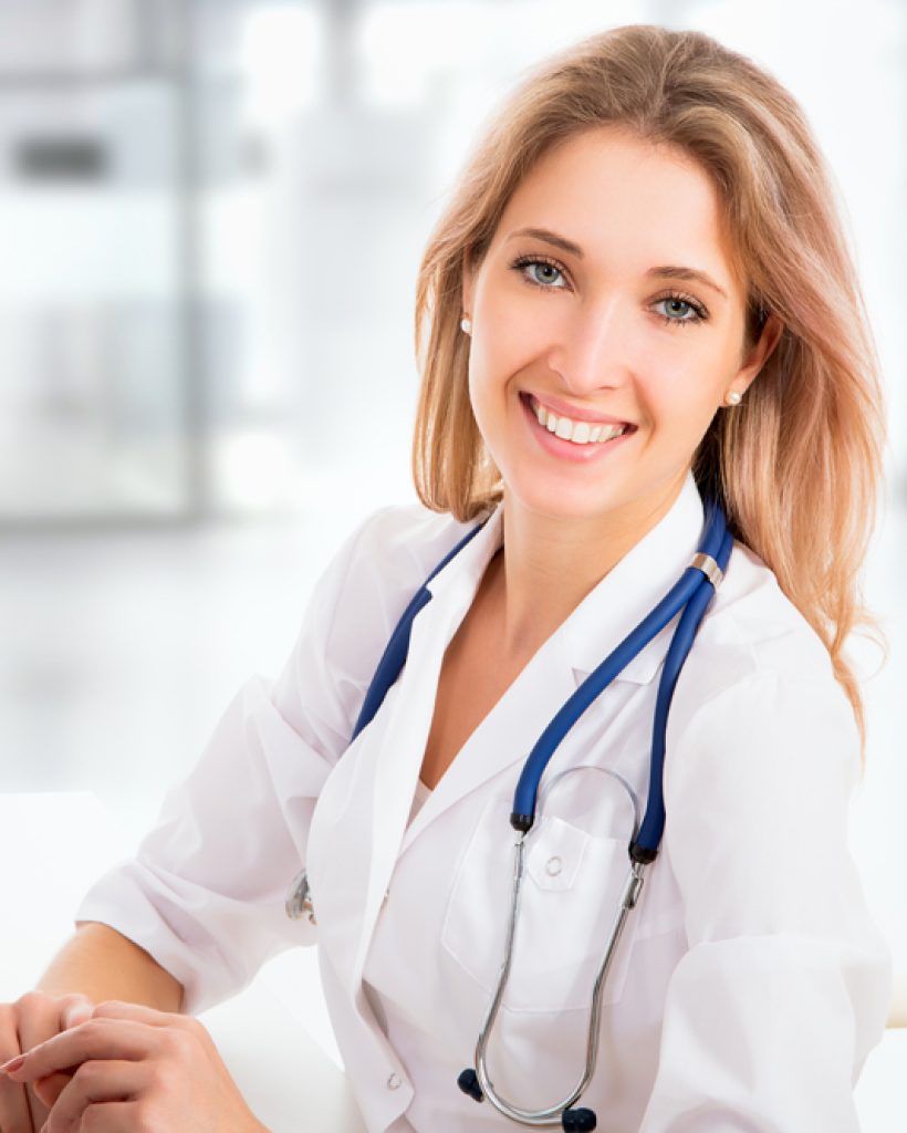 Portrait of young female doctor smiling